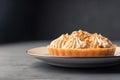 Dessert basket with caramel on black wooden background