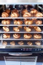 Dessert bread baking in Combi steamer. Production oven at the bakery. Baking bread. Manufacture of bread. Royalty Free Stock Photo