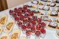 Dessert buffet with fresh fruits in glasses and apple pie with vanilla sauce and warm cinnamon cake with fresh fruits, Germany
