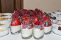 Dessert buffet with fresh fruits in glasses and apple pie with vanilla sauce and warm cinnamon cake with fresh fruits, Germany