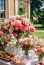 Dessert buffet with peony flowers, catering for wedding, party and holiday celebration, cakes and desserts in a countryside garden