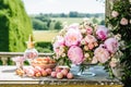 Dessert buffet with peony flowers, catering for wedding, party and holiday celebration, cakes and desserts in a countryside garden Royalty Free Stock Photo