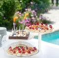 Dessert buffet, small chocolate and strawberry cakes, birthday candlees