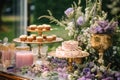 Dessert buffet table, food catering for wedding, party holiday celebration, lavender decor, cakes and desserts in a country garden Royalty Free Stock Photo