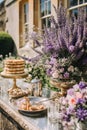 Dessert buffet table, food catering for wedding, party holiday celebration, lavender decor, cakes and desserts in a country garden Royalty Free Stock Photo