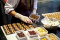 Dessert chef preparing milk chocolate and almond appetizer