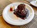 Dessert with chocolate brownie and vanilla ice cream, covered in hot chocolate sauce Royalty Free Stock Photo