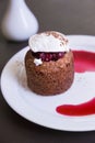 Dessert with chocolate sponge cake, cherry and vanilla ice cream