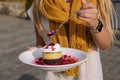 Dessert with chocolate-vanilla layer, white cream and cherry jam Royalty Free Stock Photo