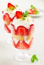 dessert with cookies, strawberries and whipped cream in a glass, selective focus, horizontal Royalty Free Stock Photo