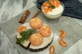 Dessert with cottage cheese and tangerines in a glass bowl