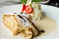 Apple strudel with cream