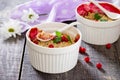 Dessert crumble with red currants on a dark wooden table Royalty Free Stock Photo