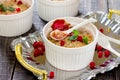 Dessert crumble with red currants on a dark wooden table Royalty Free Stock Photo