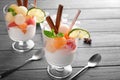 Dessert with delicious melon balls on wooden table Royalty Free Stock Photo