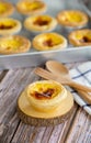 Egg tart or Portugal egg tart sweet custard cream on wooden board with wooden spoon