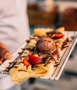 Dessert in a fancy restaurant, in the form of carrot cake, crepe and ice cream Royalty Free Stock Photo