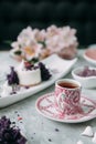 Dessert with flowers and coffee on the table Royalty Free Stock Photo