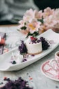 Dessert with flowers and coffee on the table Royalty Free Stock Photo