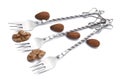 Dessert forks with almonds and a walnut Royalty Free Stock Photo