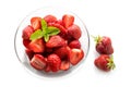 Dessert from fresh strawberries with peppermint garnish in a glass bowl, isolated with shadows on a white background, high angle Royalty Free Stock Photo