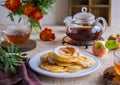 Dessert, fried rings of apples in batter on a white plate on a light concrete background. Apples recipes Royalty Free Stock Photo