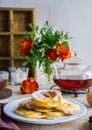 Dessert, fried rings of apples in batter on a white plate on a light concrete background. Apples recipes Royalty Free Stock Photo