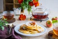 Dessert, fried rings of apples in batter on a white plate on a light concrete background. Apples recipes Royalty Free Stock Photo