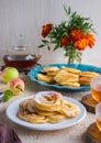 Dessert, fried rings of apples in batter on a white plate on a light concrete background. Apples recipes Royalty Free Stock Photo