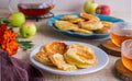 Dessert, fried rings of apples in batter on a white plate on a light concrete background. Apples recipes Royalty Free Stock Photo