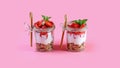 Dessert in a glass with granola, yogurt and strawberries. Useful breakfast. isolated on pink background. Authentic lifestyle image Royalty Free Stock Photo