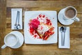 Dessert ice cream strawberry crepe and hot drink in coffee shop Royalty Free Stock Photo