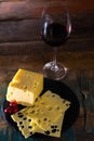 Dessert with medium-hard mild Swiss cheese Emmental and glass re Royalty Free Stock Photo