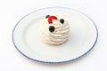 Dessert of meringue and berries on a plate. A cake with fresh blueberries and strawberries. Whipped cream. White Royalty Free Stock Photo