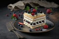 dessert napoleon cake in form of rectangular cake with cream and berries on plate