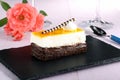 Dessert orange cake on black stone Royalty Free Stock Photo