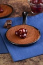 Dessert pan with brownie and bing cherries