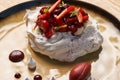 Dessert Pavloca cake with fruits and berry ice cream Royalty Free Stock Photo