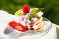 Dessert plate with pancakes, strawberries, yogurt and mint