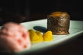 A dessert plate with strawberry ice cream with chocolate on top and a chocolate lava cake Royalty Free Stock Photo