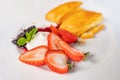 Dessert on plate with a strudel pie, sweet strawberries and a delicacy of mulberries and whipped cream. Concept of harmful sweet Royalty Free Stock Photo