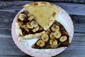 A dessert plate of A sweet baked pastry of chocolate pizza, Chakhtoura, sweet baked pastry baked in the oven, covered with
