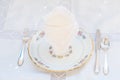 Dessert set: porcelain plates with silver cutery and lace napkin
