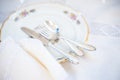 Dessert set: porcelain plates with silver cutery and lace napkin