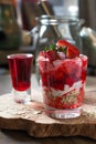 Dessert of soy yogurt and oatmeal, strawberry juice and fresh strawberries on a wooden tray, Royalty Free Stock Photo