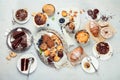 Dessert table with all kinds snacks on light background