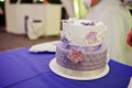 Dessert table of delicious violet wedding cake