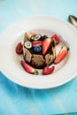 Dessert with tonka cream, chocolate and berries