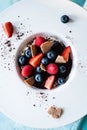 Dessert with tonka cream, chocolate and berries