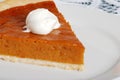 Dessert topping on pumpkin pie focus on whip cream Royalty Free Stock Photo